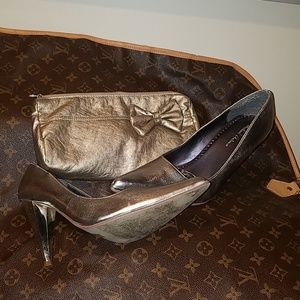 Gold heels and pouch.
